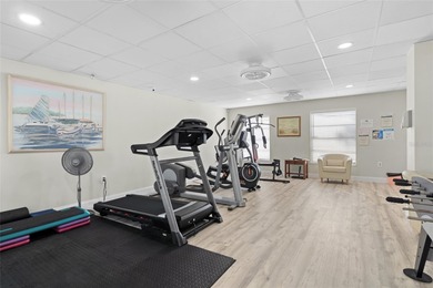 Welcome home to Mediterranean Manor, an idyllic waterfront on The Dunedin Country Club in Florida - for sale on GolfHomes.com, golf home, golf lot