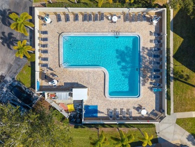 Welcome home to Mediterranean Manor, an idyllic waterfront on The Dunedin Country Club in Florida - for sale on GolfHomes.com, golf home, golf lot