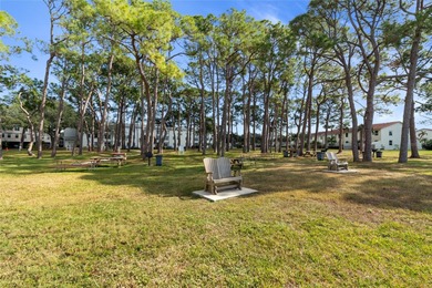 Welcome home to Mediterranean Manor, an idyllic waterfront on The Dunedin Country Club in Florida - for sale on GolfHomes.com, golf home, golf lot
