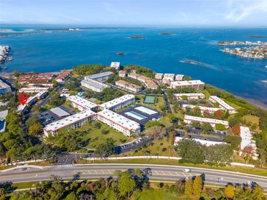 Welcome home to Mediterranean Manor, an idyllic waterfront on The Dunedin Country Club in Florida - for sale on GolfHomes.com, golf home, golf lot