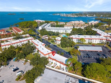 Welcome home to Mediterranean Manor, an idyllic waterfront on The Dunedin Country Club in Florida - for sale on GolfHomes.com, golf home, golf lot