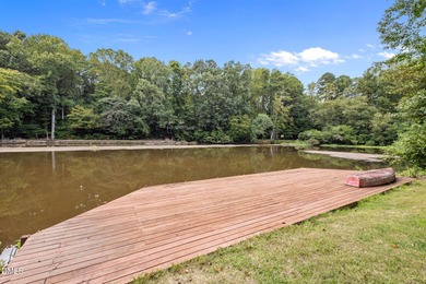 Nestled on nearly half an acre along the 2 mile long Lochmere on Lochmere Golf Club in North Carolina - for sale on GolfHomes.com, golf home, golf lot