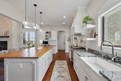 This stunning home sits on a premium corner lot backing to Hole on The Bridges Golf Club in Texas - for sale on GolfHomes.com, golf home, golf lot