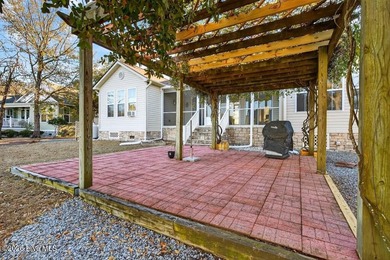 You'll love coming home to this well built, well maintained on Harbour Point Golf Club in North Carolina - for sale on GolfHomes.com, golf home, golf lot