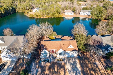 You'll love coming home to this well built, well maintained on Harbour Point Golf Club in North Carolina - for sale on GolfHomes.com, golf home, golf lot