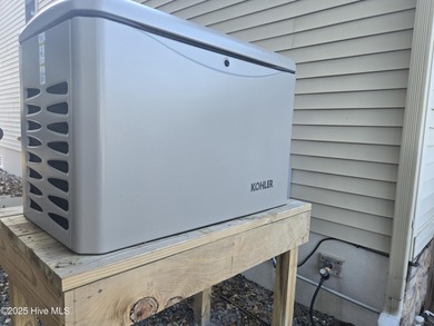 You'll love coming home to this well built, well maintained on Harbour Point Golf Club in North Carolina - for sale on GolfHomes.com, golf home, golf lot