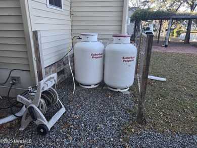 You'll love coming home to this well built, well maintained on Harbour Point Golf Club in North Carolina - for sale on GolfHomes.com, golf home, golf lot