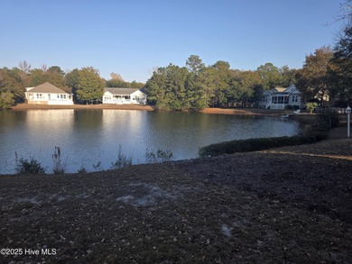 You'll love coming home to this well built, well maintained on Harbour Point Golf Club in North Carolina - for sale on GolfHomes.com, golf home, golf lot