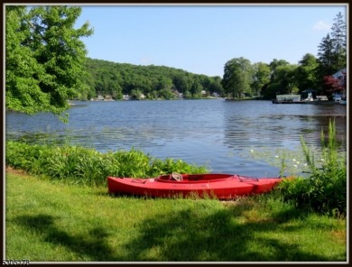 Proudly offered by the son of the first owner, this hidden gem on Lake Lackawanna Golf Course in New Jersey - for sale on GolfHomes.com, golf home, golf lot