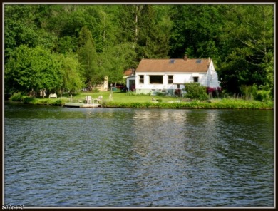 Proudly offered by the son of the first owner, this hidden gem on Lake Lackawanna Golf Course in New Jersey - for sale on GolfHomes.com, golf home, golf lot