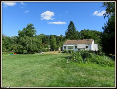 Proudly offered by the son of the first owner, this hidden gem on Lake Lackawanna Golf Course in New Jersey - for sale on GolfHomes.com, golf home, golf lot