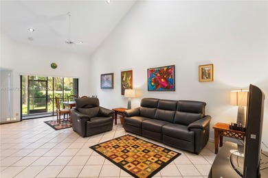 This spacious well maintained 3-bedroom, 2.5-bath townhome with on Woodmont Country Club in Florida - for sale on GolfHomes.com, golf home, golf lot