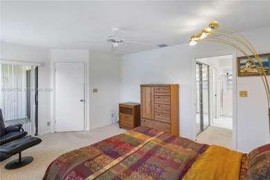 This spacious well maintained 3-bedroom, 2.5-bath townhome with on Woodmont Country Club in Florida - for sale on GolfHomes.com, golf home, golf lot