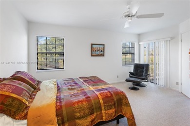 This spacious well maintained 3-bedroom, 2.5-bath townhome with on Woodmont Country Club in Florida - for sale on GolfHomes.com, golf home, golf lot