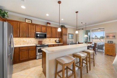 Discover this beautiful Shenandoah model overlooking priceless on Stone Creek Golf Club in Florida - for sale on GolfHomes.com, golf home, golf lot