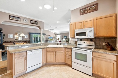 BOND PAID on this charming TURNKEY 3/2 HIBISCUS DESIGNER HOME on Oakleigh Executive Golf Course in Florida - for sale on GolfHomes.com, golf home, golf lot