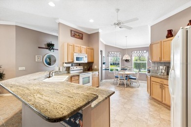 BOND PAID on this charming TURNKEY 3/2 HIBISCUS DESIGNER HOME on Oakleigh Executive Golf Course in Florida - for sale on GolfHomes.com, golf home, golf lot