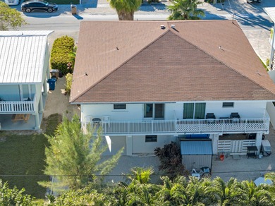 Discover this charming and affordable 2-bedroom, 2-bath half on Key Colony Beach Golf Course in Florida - for sale on GolfHomes.com, golf home, golf lot