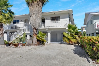 Discover this charming and affordable 2-bedroom, 2-bath half on Key Colony Beach Golf Course in Florida - for sale on GolfHomes.com, golf home, golf lot