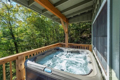 Offered FULLY FURNISHED, this stunning mountain retreat sits at on Wolf Laurel Country Club in North Carolina - for sale on GolfHomes.com, golf home, golf lot