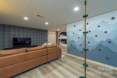 Offered FULLY FURNISHED, this stunning mountain retreat sits at on Wolf Laurel Country Club in North Carolina - for sale on GolfHomes.com, golf home, golf lot