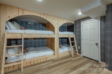 Offered FULLY FURNISHED, this stunning mountain retreat sits at on Wolf Laurel Country Club in North Carolina - for sale on GolfHomes.com, golf home, golf lot