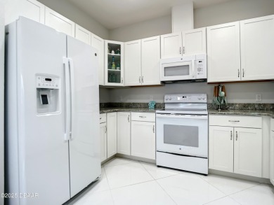 Your Slice of Paradise Is Calling! This spacious 3-bedroom on LPGA International Golf Course in Florida - for sale on GolfHomes.com, golf home, golf lot