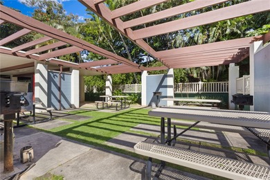 Breezy end/corner unit with golf course views near Pearlridge! on Pearl Country Club in Hawaii - for sale on GolfHomes.com, golf home, golf lot