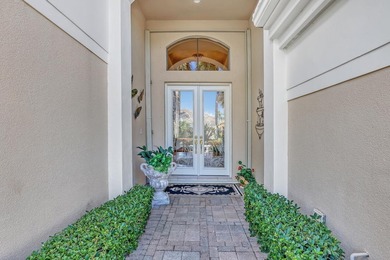 Wake up to tranquil water and fairway views in this light-filled on  in Florida - for sale on GolfHomes.com, golf home, golf lot