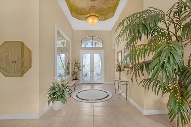 Wake up to tranquil water and fairway views in this light-filled on  in Florida - for sale on GolfHomes.com, golf home, golf lot