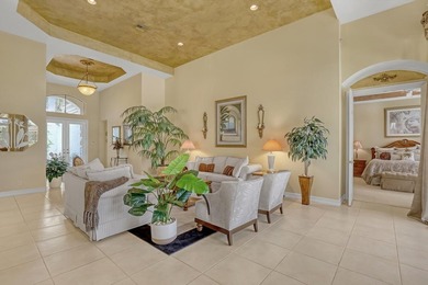 Wake up to tranquil water and fairway views in this light-filled on  in Florida - for sale on GolfHomes.com, golf home, golf lot
