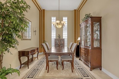 Wake up to tranquil water and fairway views in this light-filled on  in Florida - for sale on GolfHomes.com, golf home, golf lot