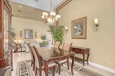 Wake up to tranquil water and fairway views in this light-filled on  in Florida - for sale on GolfHomes.com, golf home, golf lot