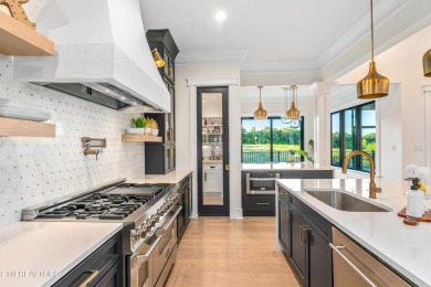 Welcome to this stylish executive home located on a 1+ acre lot on Ruggles Ferry Golf Club in Tennessee - for sale on GolfHomes.com, golf home, golf lot