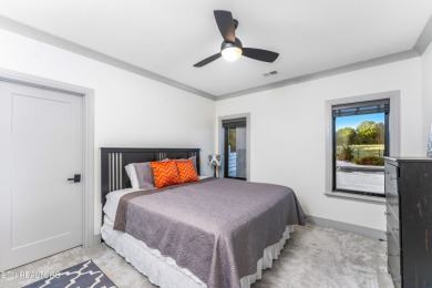 Welcome to this stylish executive home located on a 1+ acre lot on Ruggles Ferry Golf Club in Tennessee - for sale on GolfHomes.com, golf home, golf lot
