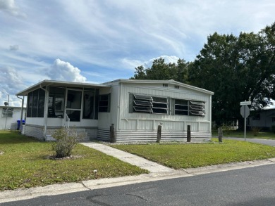This double-wide home is in a popular 55+ park on Lake Gibson on Wedgewood Golf Club in Florida - for sale on GolfHomes.com, golf home, golf lot