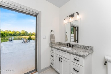 Welcome to this stylish executive home located on a 1+ acre lot on Ruggles Ferry Golf Club in Tennessee - for sale on GolfHomes.com, golf home, golf lot