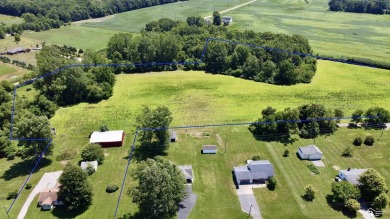 Discover the potential of this 2/3-bedroom ranch home situated on Dundee Golf Club in Michigan - for sale on GolfHomes.com, golf home, golf lot
