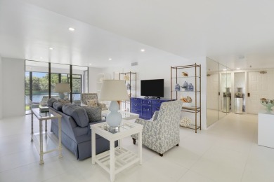 Welcome to this spacious 1st floor unit with covered parking on BallenIsles Golf and Country Club in Florida - for sale on GolfHomes.com, golf home, golf lot