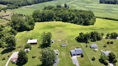 Discover the potential of this 2/3-bedroom ranch home situated on Dundee Golf Club in Michigan - for sale on GolfHomes.com, golf home, golf lot