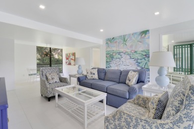 Welcome to this spacious 1st floor unit with covered parking on BallenIsles Golf and Country Club in Florida - for sale on GolfHomes.com, golf home, golf lot