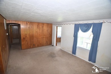 Discover the potential of this 2/3-bedroom ranch home situated on Dundee Golf Club in Michigan - for sale on GolfHomes.com, golf home, golf lot