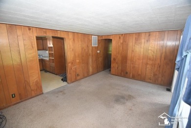 Discover the potential of this 2/3-bedroom ranch home situated on Dundee Golf Club in Michigan - for sale on GolfHomes.com, golf home, golf lot