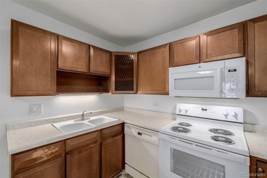 Step into this move in ready ground level condo in the heart of on Emerald Greens Golf Club in Colorado - for sale on GolfHomes.com, golf home, golf lot