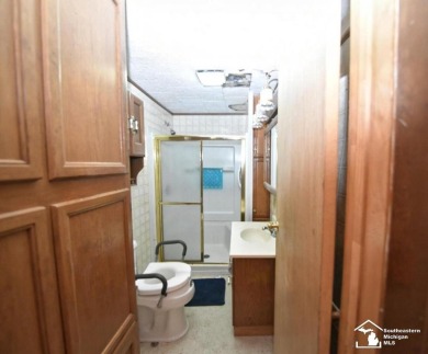 Discover the potential of this 2/3-bedroom ranch home situated on Dundee Golf Club in Michigan - for sale on GolfHomes.com, golf home, golf lot
