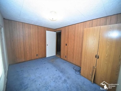 Discover the potential of this 2/3-bedroom ranch home situated on Dundee Golf Club in Michigan - for sale on GolfHomes.com, golf home, golf lot