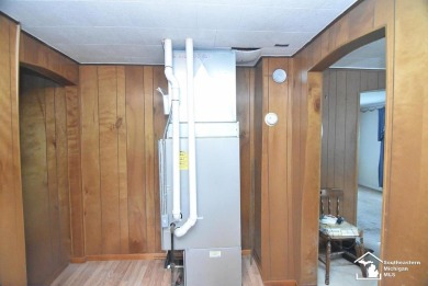 Discover the potential of this 2/3-bedroom ranch home situated on Dundee Golf Club in Michigan - for sale on GolfHomes.com, golf home, golf lot
