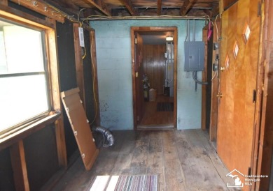 Discover the potential of this 2/3-bedroom ranch home situated on Dundee Golf Club in Michigan - for sale on GolfHomes.com, golf home, golf lot