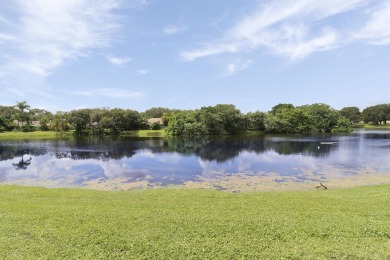 Welcome to this spacious 1st floor unit with covered parking on BallenIsles Golf and Country Club in Florida - for sale on GolfHomes.com, golf home, golf lot