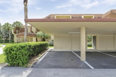 Welcome to this spacious 1st floor unit with covered parking on BallenIsles Golf and Country Club in Florida - for sale on GolfHomes.com, golf home, golf lot